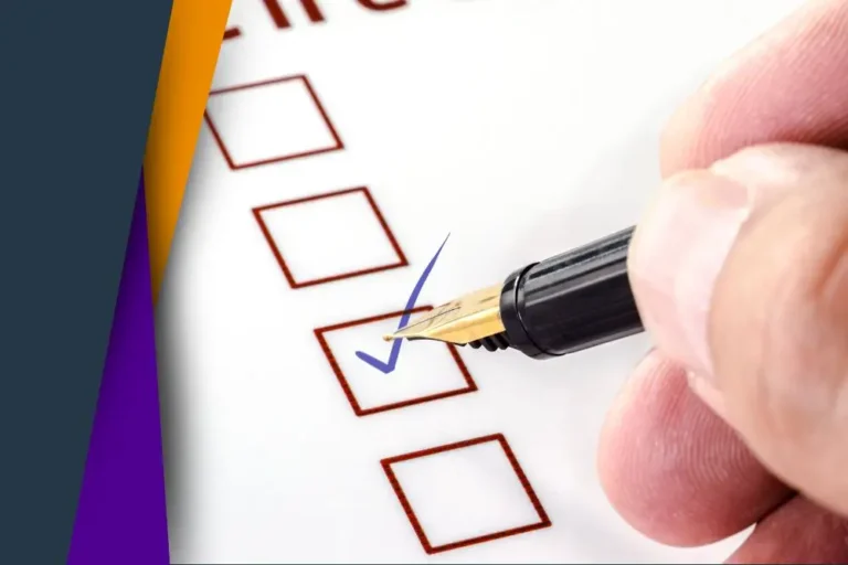 Hand checking a box on paper